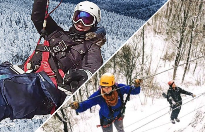 Two people ziplining on the Mont-Catherine Via Ferrata in snowy, mountainous terrain, separated by a diagonal split; both are wearing helmets and winter gear.