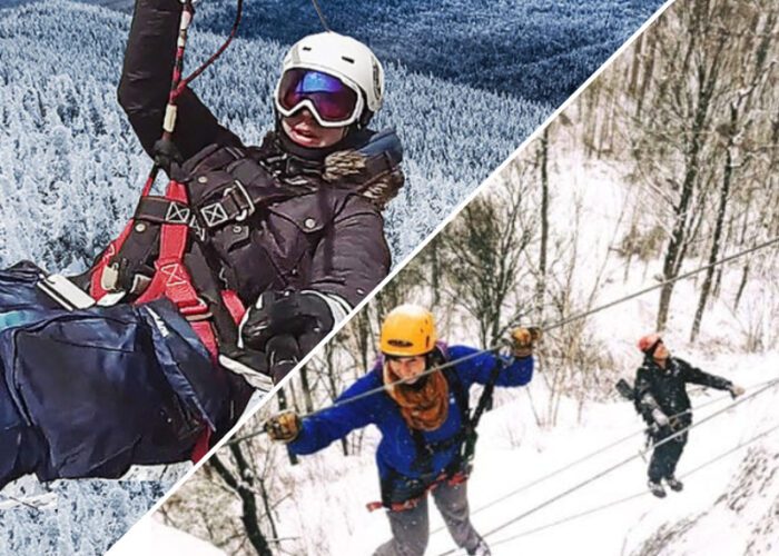 Two people ziplining on the Mont-Catherine Via Ferrata in snowy, mountainous terrain, separated by a diagonal split; both are wearing helmets and winter gear.