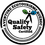 Circular stamp logo reading "Aventure Écotourisme Québec, Quality Safety Certified" with a human figure holding two leaves in blue and green—ideal for Diable Adventure or dogsledding experiences.