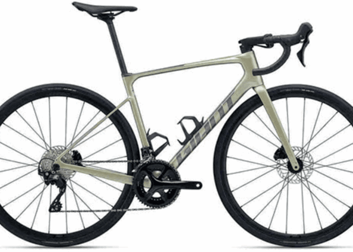 A modern road bicycle with a lightweight frame, drop handlebars, disc brakes, and thin tires, photographed from the side against a white background.