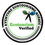 A circular badge featuring "Aventure Écotourisme Québec" around the edge and "Ecotourism Verified" in the center, with a figure whose arms are green and blue leaves—symbolizing Quebec Certification in ecotourisme excellence.